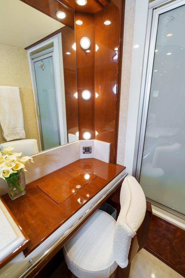 a bathroom with a countertop sink and a mirror aboard LA BELLA VITA Yacht for Sale