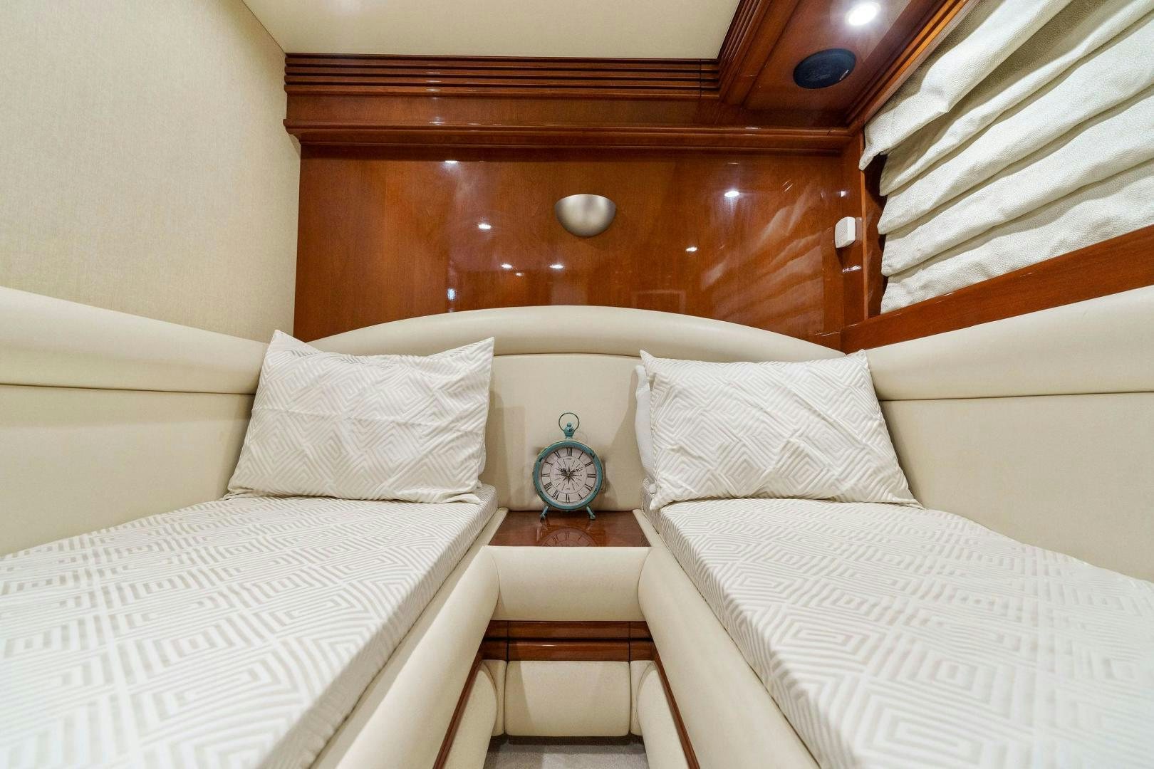 a bed with white sheets aboard LA BELLA VITA Yacht for Sale