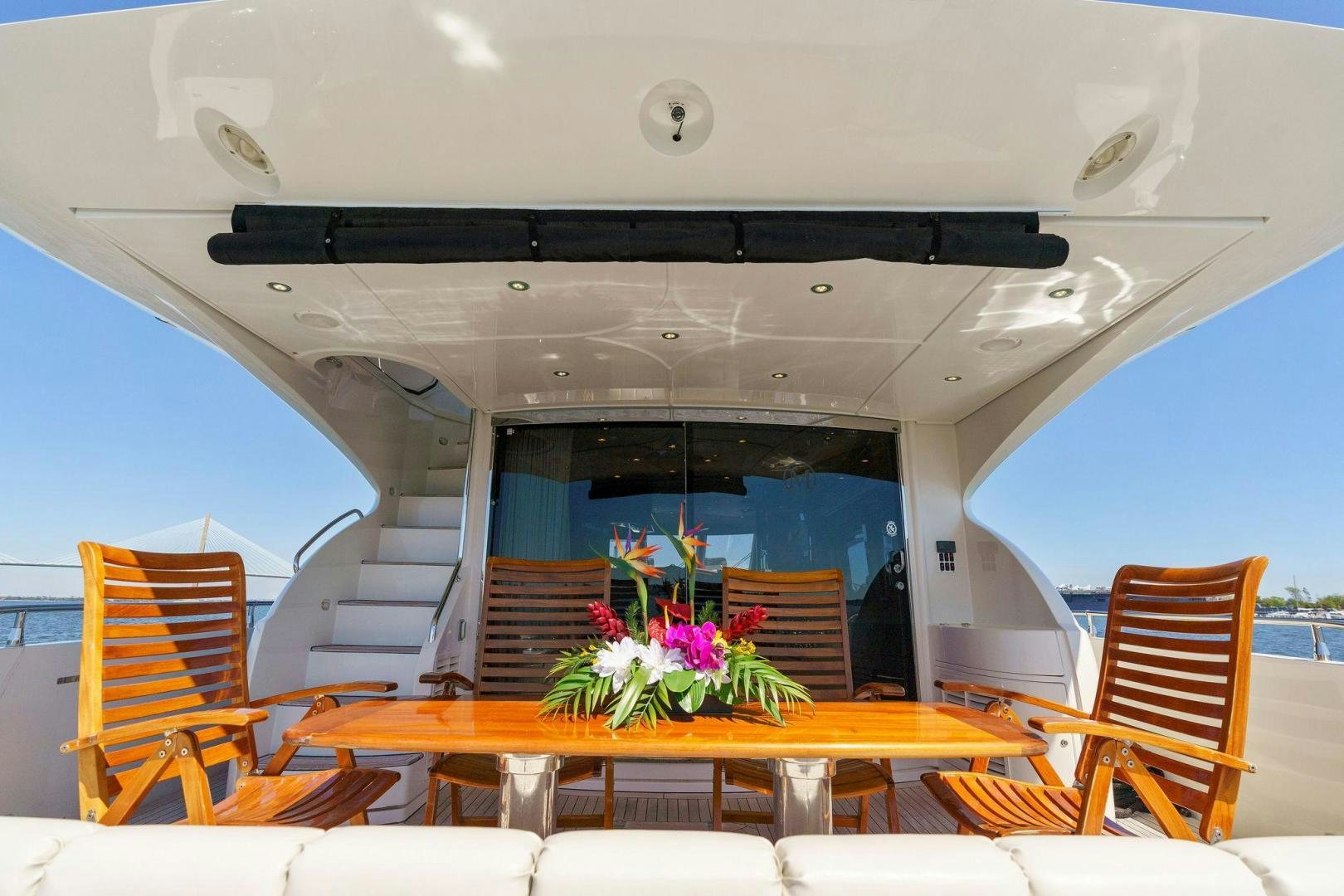 a room with chairs and a table aboard LA BELLA VITA Yacht for Sale