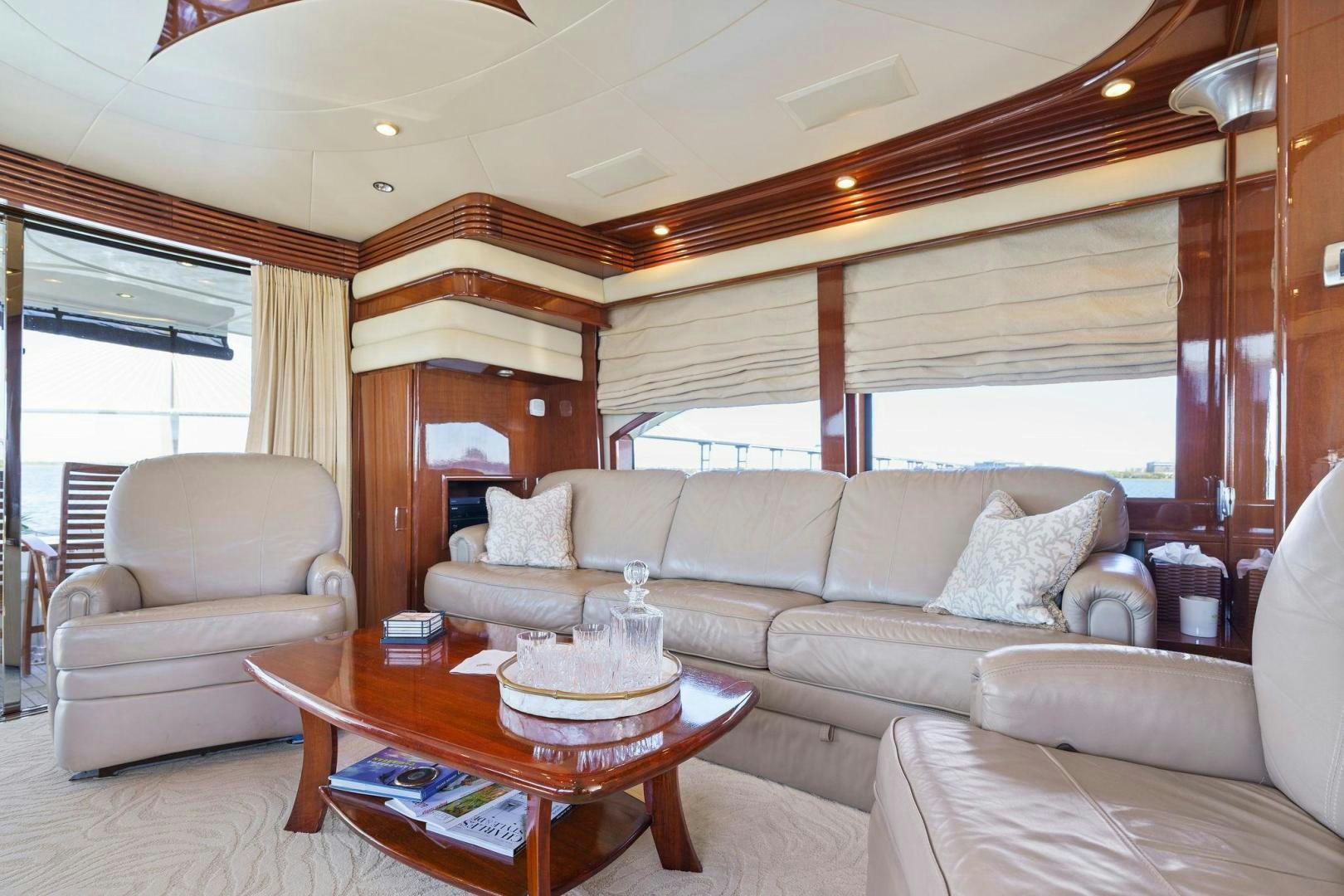 a living room with a couch and a table aboard LA BELLA VITA Yacht for Sale