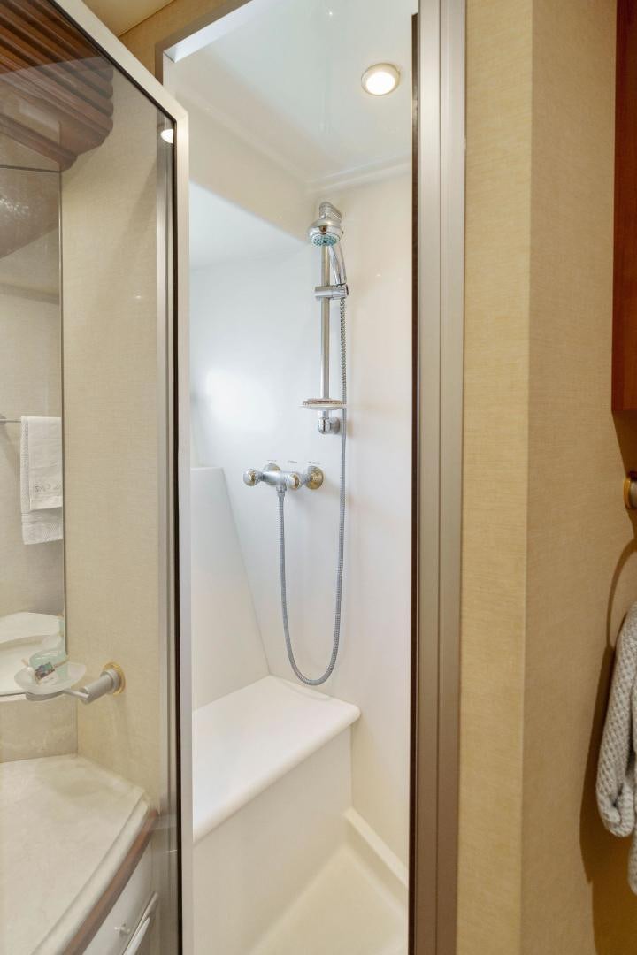 a bathroom with a shower and a sink aboard LA BELLA VITA Yacht for Sale