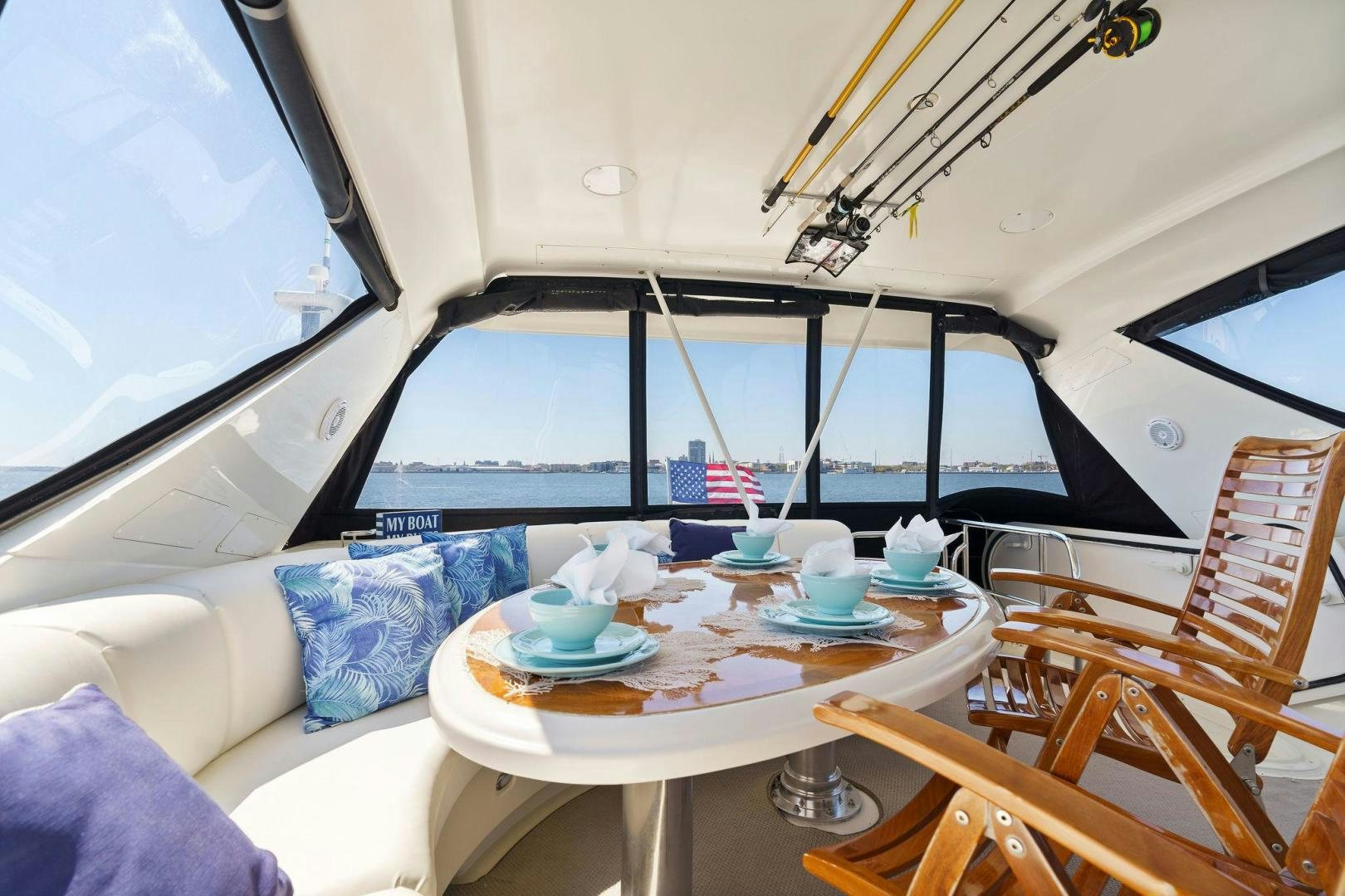 a room with a table and chairs aboard LA BELLA VITA Yacht for Sale