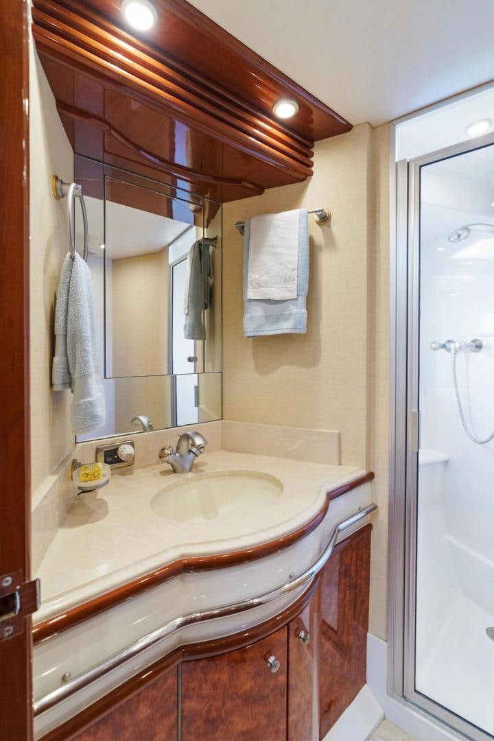 a bathroom with a sink and a mirror aboard LA BELLA VITA Yacht for Sale