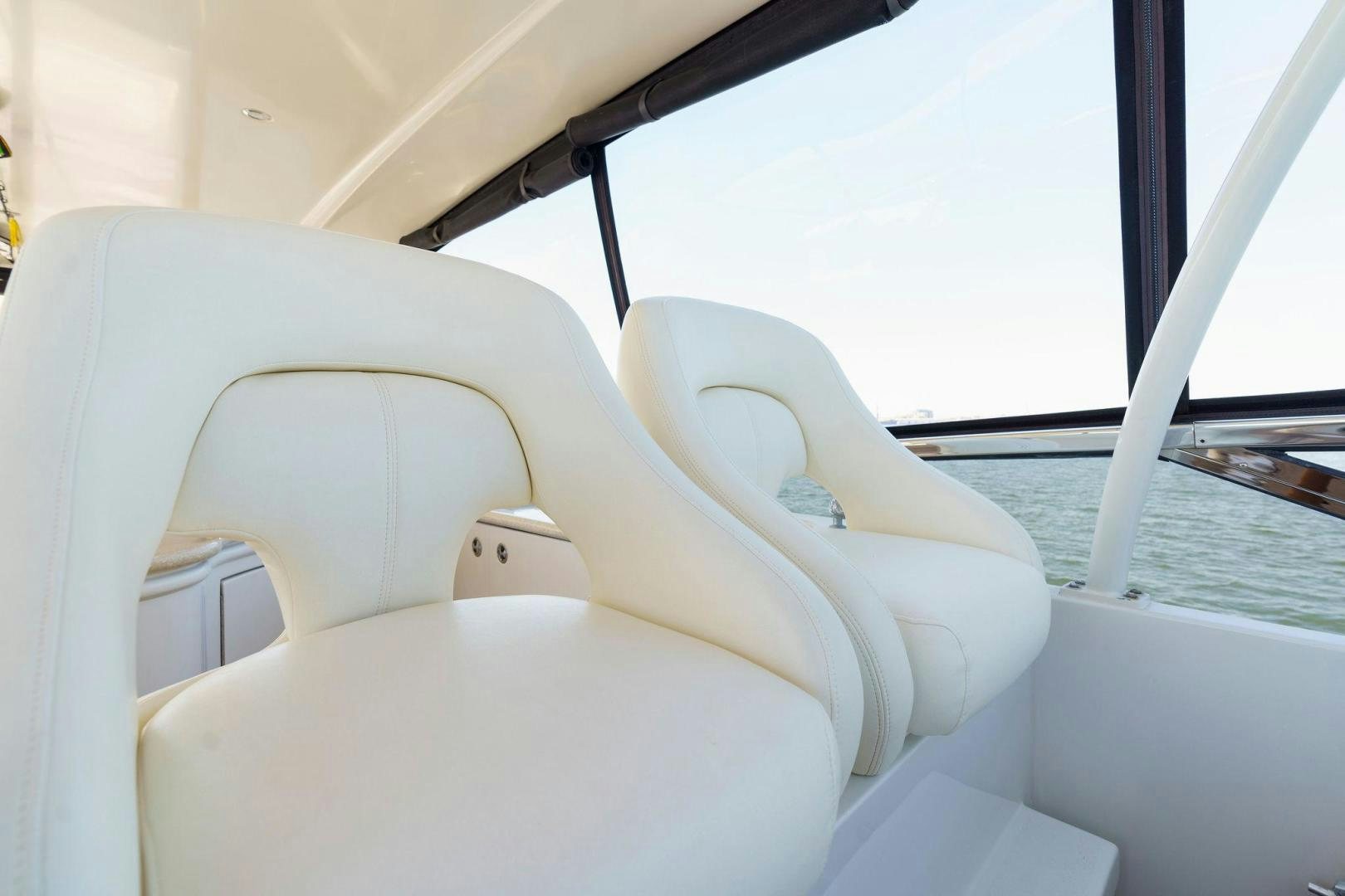 a white chair on a boat aboard LA BELLA VITA Yacht for Sale