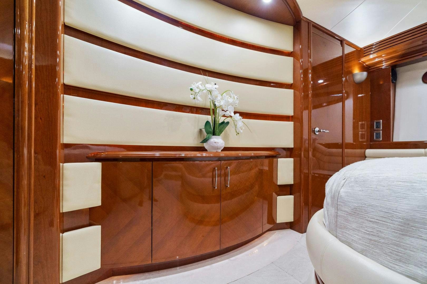 a wooden cabinet with white drawers aboard LA BELLA VITA Yacht for Sale