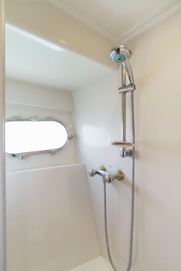a shower with a glass door aboard LA BELLA VITA Yacht for Sale