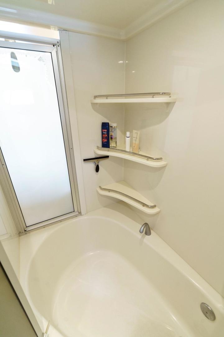 a white bathroom with a white shelf aboard LA BELLA VITA Yacht for Sale