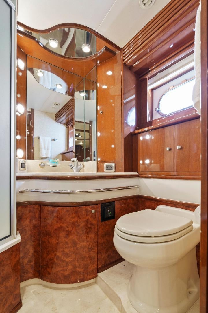 a bathroom with a large mirror aboard LA BELLA VITA Yacht for Sale