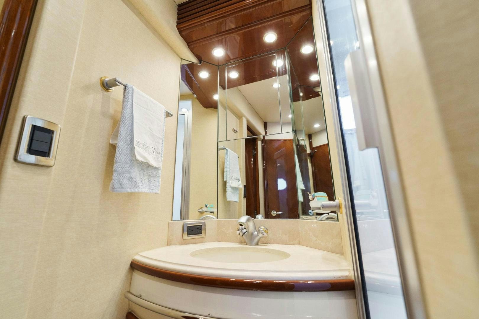 a bathroom with a large mirror aboard LA BELLA VITA Yacht for Sale