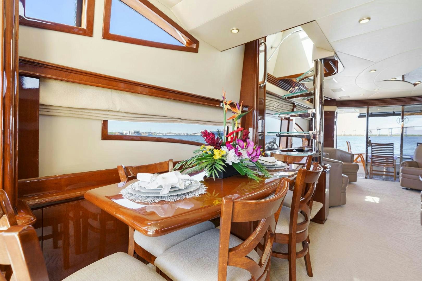 a dining table in a room aboard LA BELLA VITA Yacht for Sale