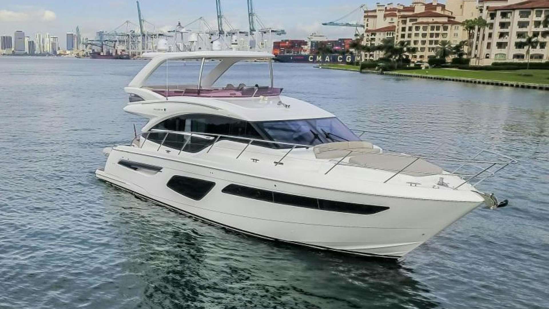 a white yacht on the water aboard SIGNED OUT Yacht for Sale