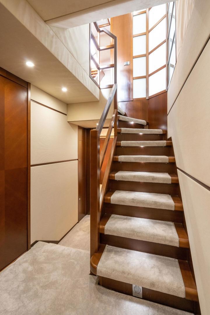 a staircase with glass doors aboard 21 SEA SANDS Yacht for Sale