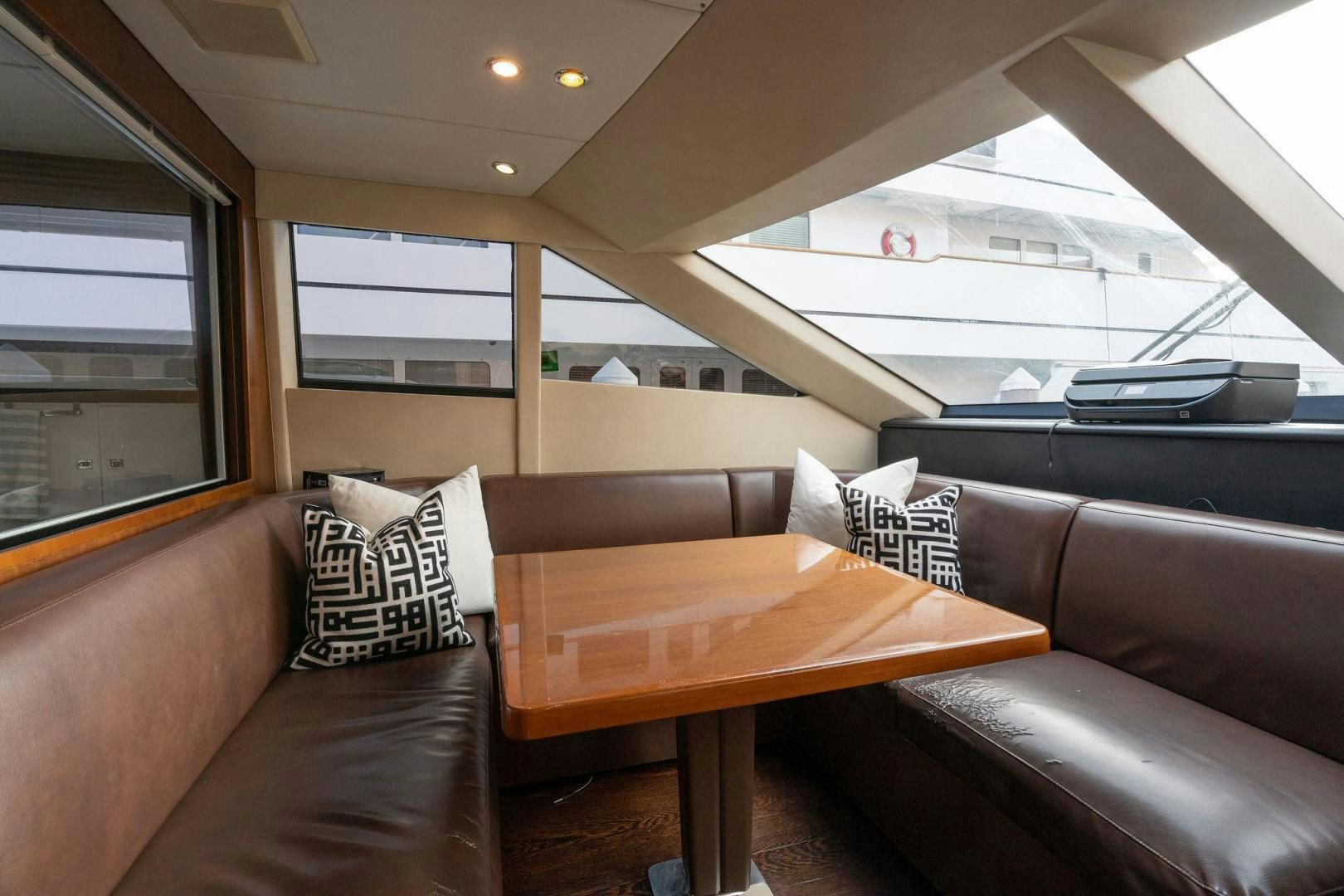 a room with a couch and a table aboard 21 SEA SANDS Yacht for Sale