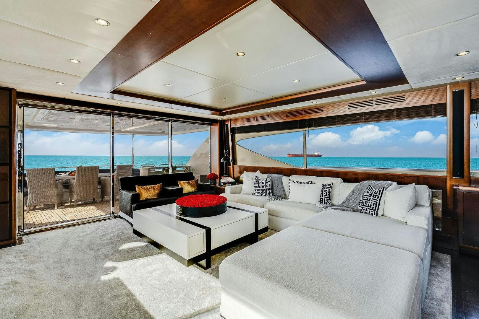 a room with a large bed and a large window aboard 21 SEA SANDS Yacht for Sale