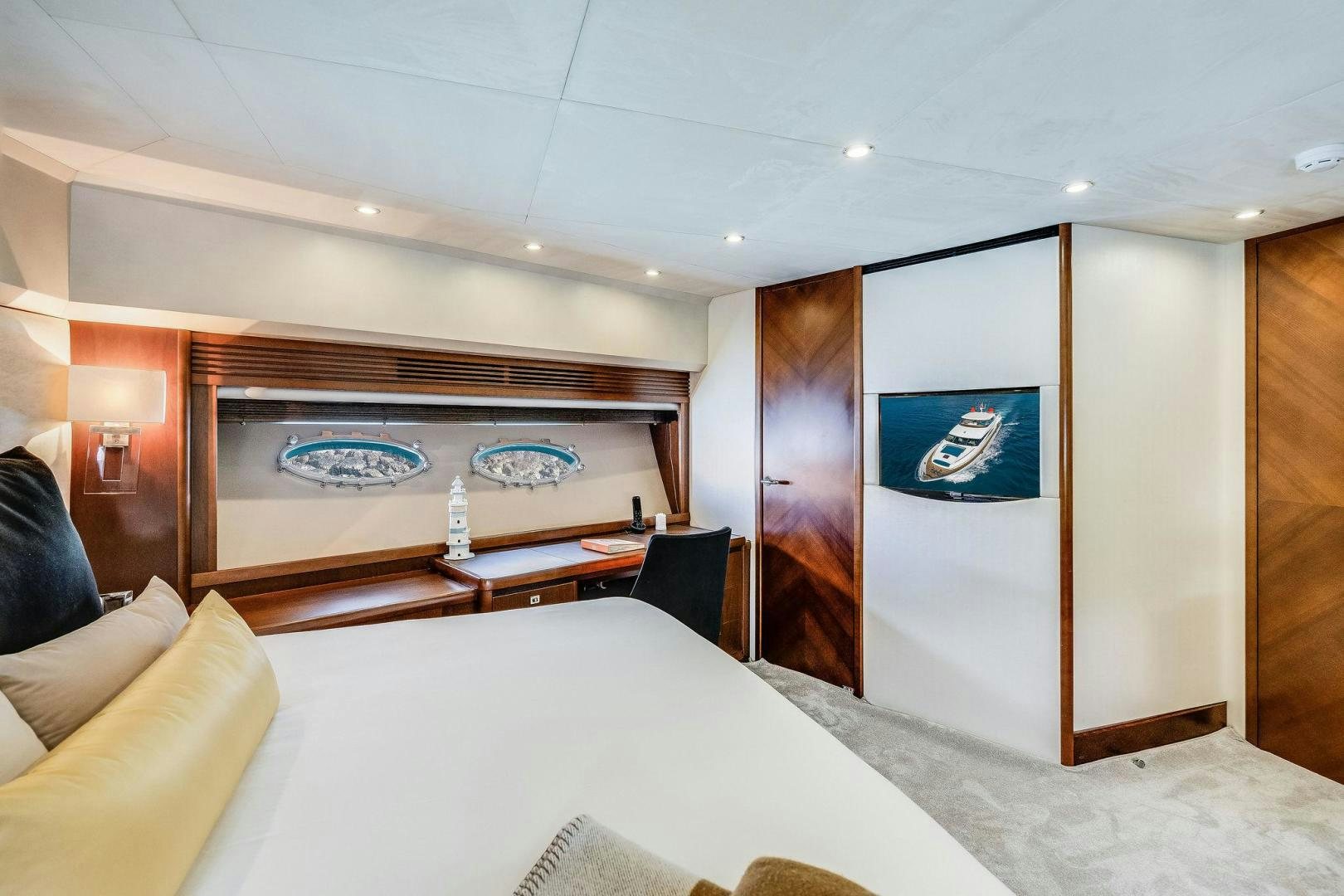 a room with a bed and a television aboard 21 SEA SANDS Yacht for Sale