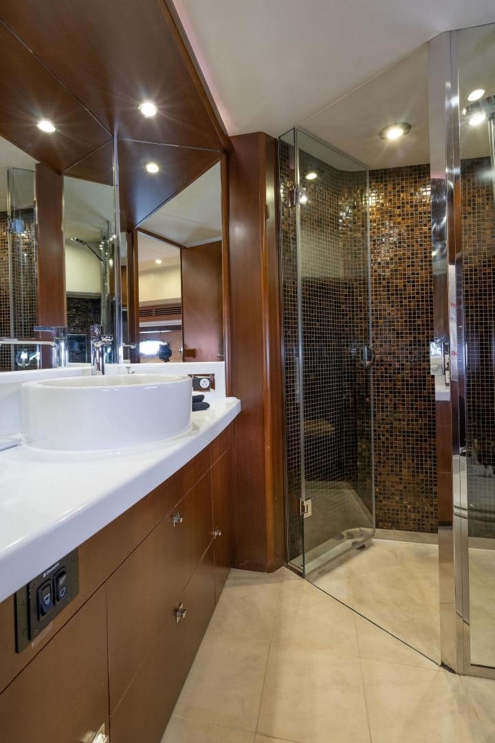 a bathroom with a shower unit and sink aboard 21 SEA SANDS Yacht for Sale