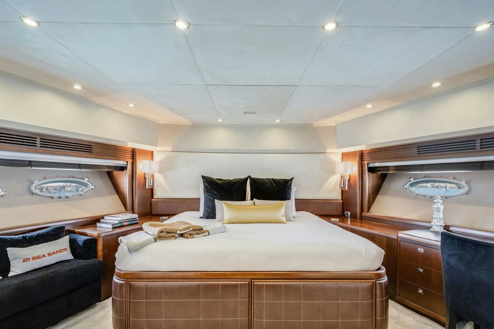 a bedroom with a bed and a couch aboard 21 SEA SANDS Yacht for Sale