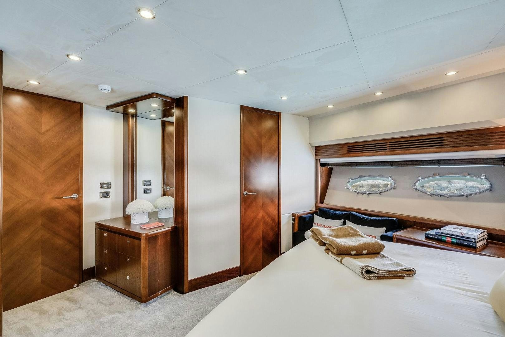 a room with a bed and a dresser aboard 21 SEA SANDS Yacht for Sale