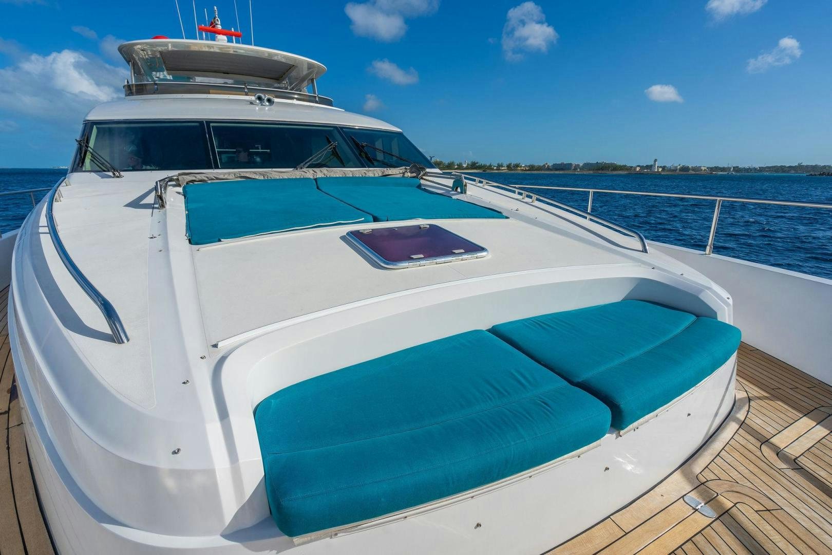 a white boat on a dock aboard 21 SEA SANDS Yacht for Sale