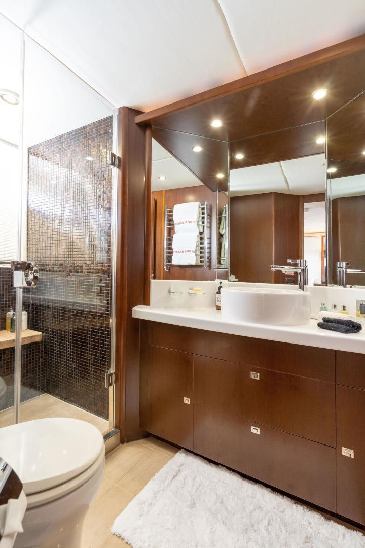 a bathroom with a glass shower aboard 21 SEA SANDS Yacht for Sale
