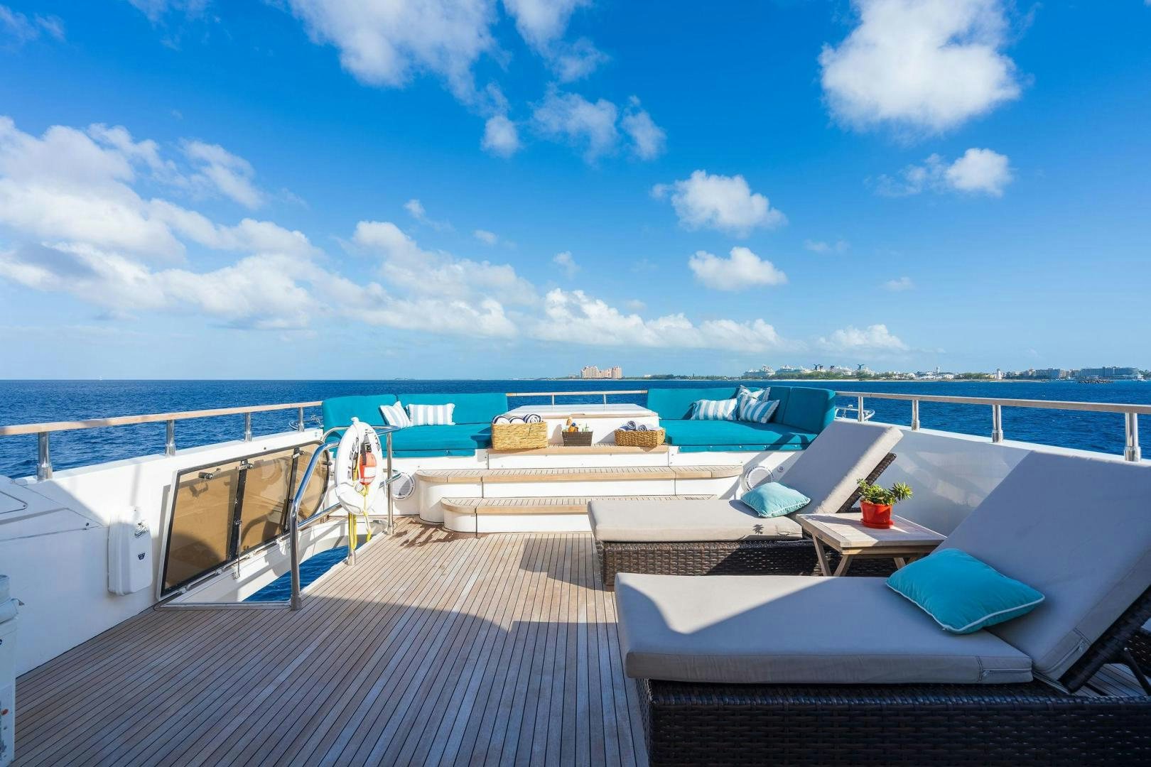 a deck with a view of the ocean and boats aboard 21 SEA SANDS Yacht for Sale