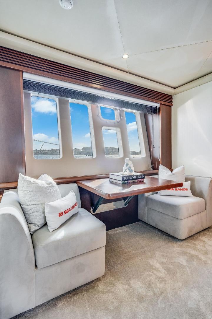 a living room with a couch and a coffee table aboard 21 SEA SANDS Yacht for Sale