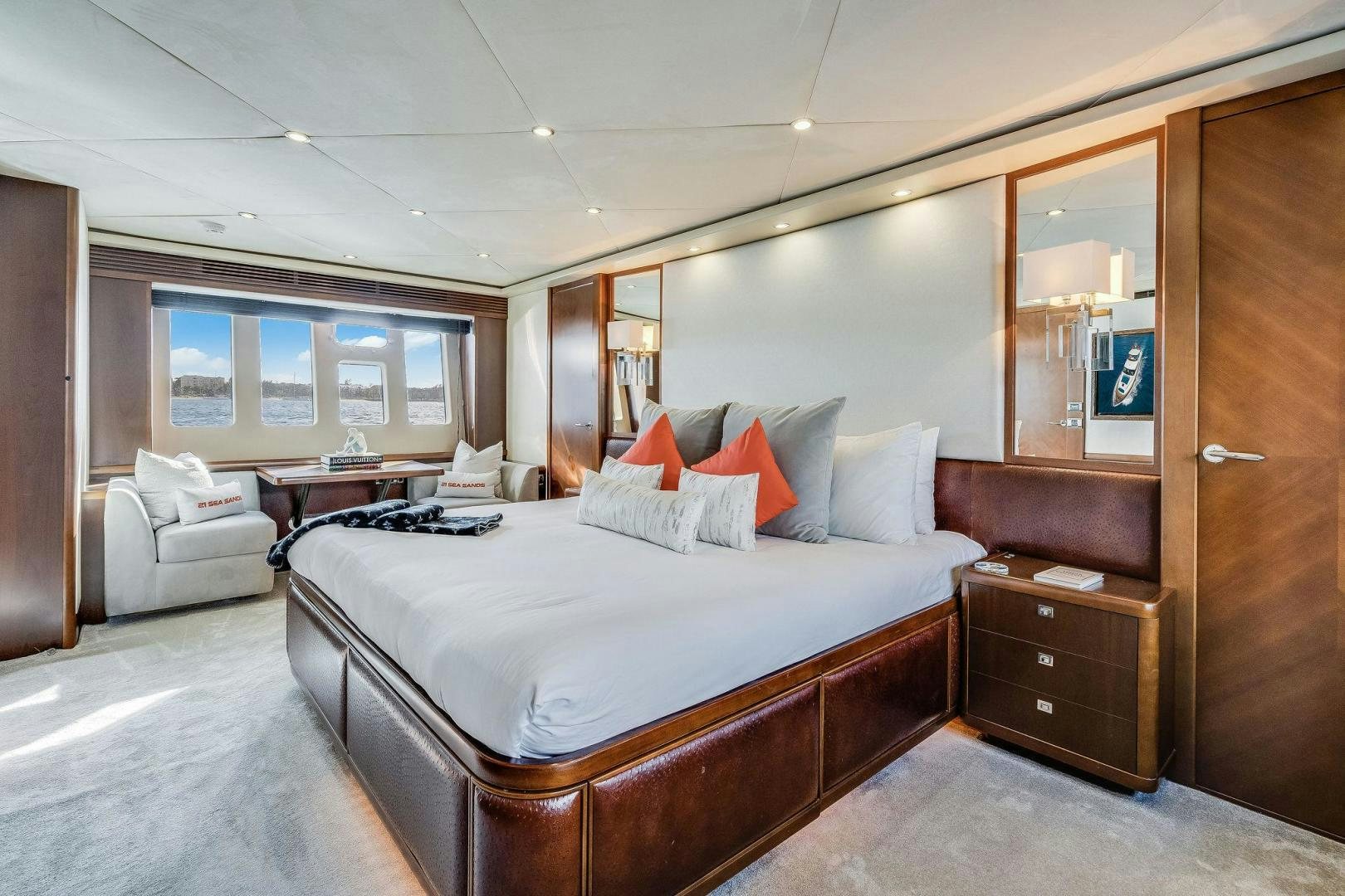 a bedroom with a bed and a desk aboard 21 SEA SANDS Yacht for Sale