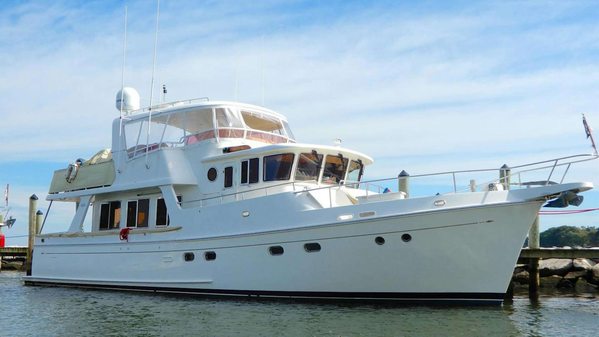 a white boat in the water aboard PEDDLER III Yacht for Sale