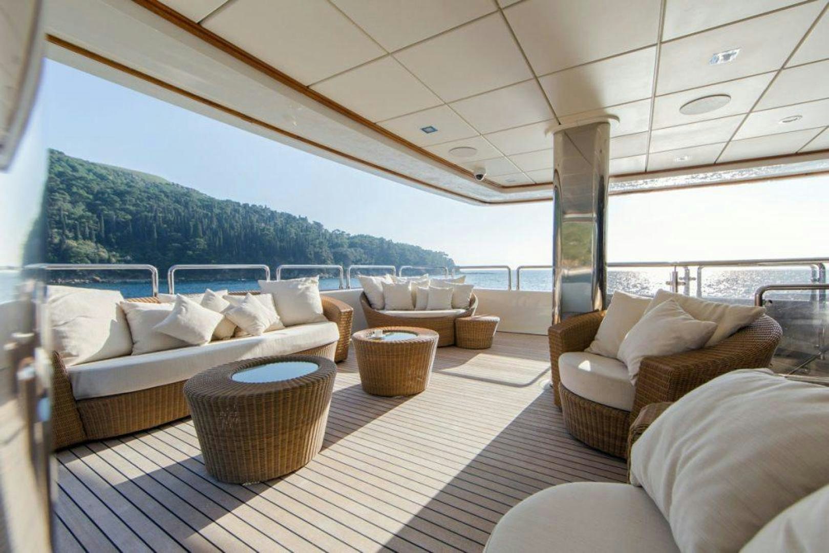 a room with a couch and a table and chairs aboard PANAKEIA Yacht for Charter