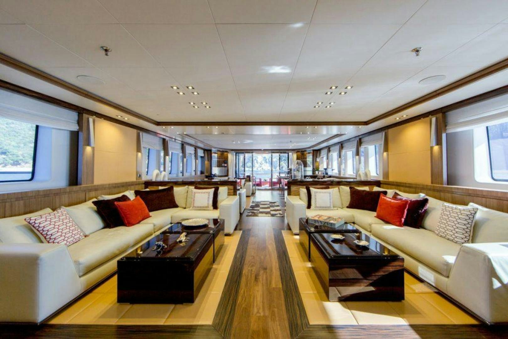 a living room with a large window aboard PANAKEIA Yacht for Charter