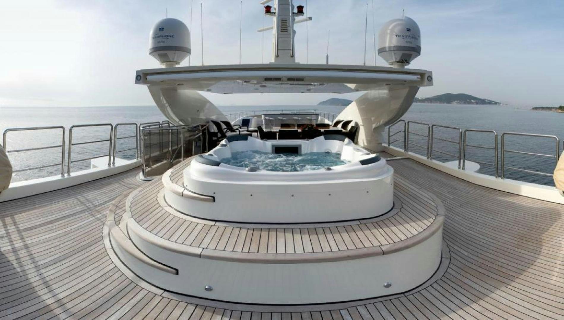 a white boat on a deck aboard PANAKEIA Yacht for Charter