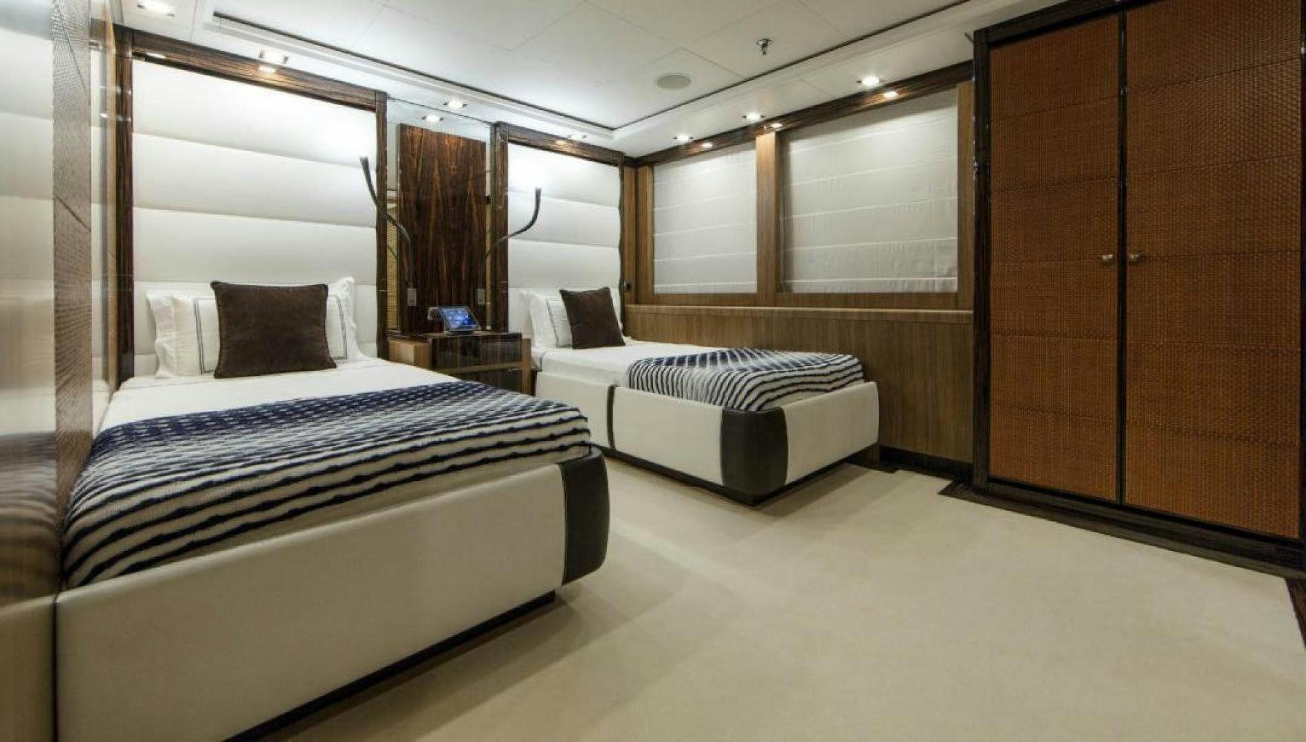 a room with two beds aboard PANAKEIA Yacht for Charter