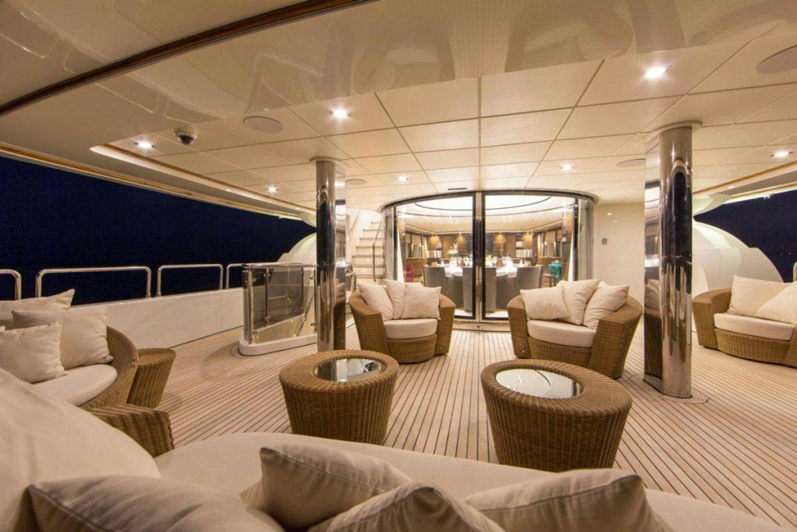 a large living room with a large glass window aboard PANAKEIA Yacht for Charter