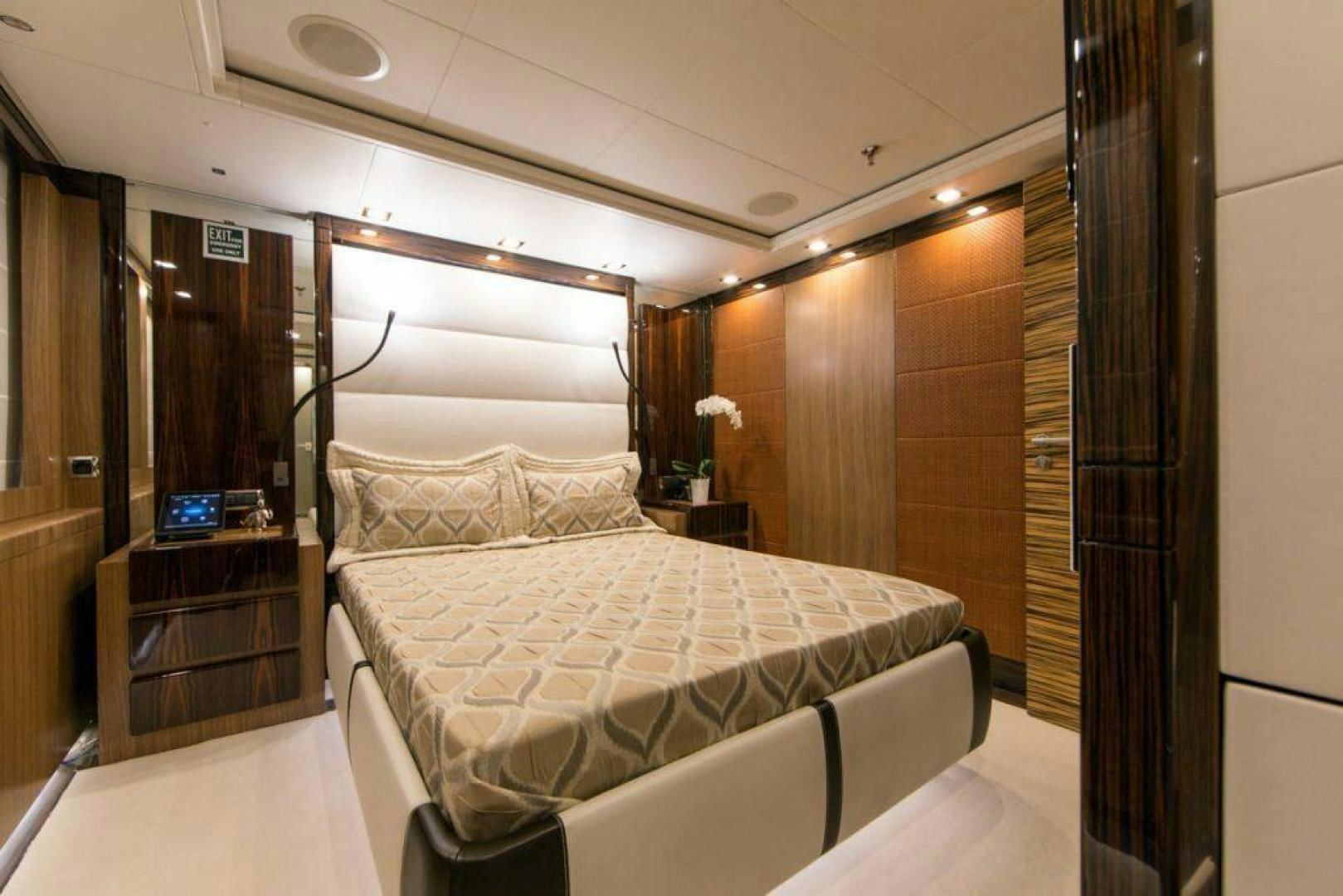 a room with a bed and a mirror aboard PANAKEIA Yacht for Charter