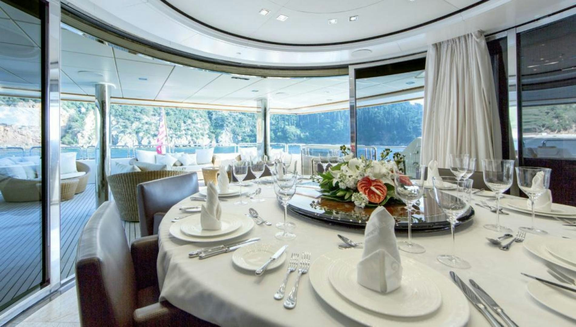 a table set for a dinner aboard PANAKEIA Yacht for Charter