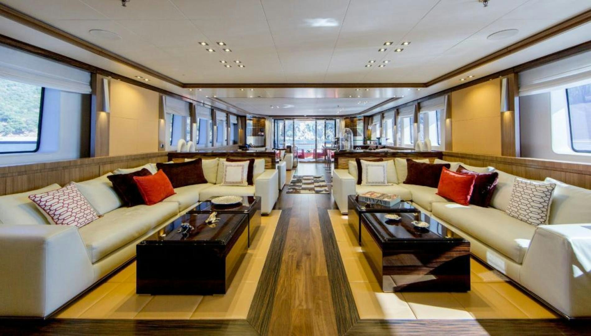 a living room with a couch and a coffee table aboard PANAKEIA Yacht for Charter