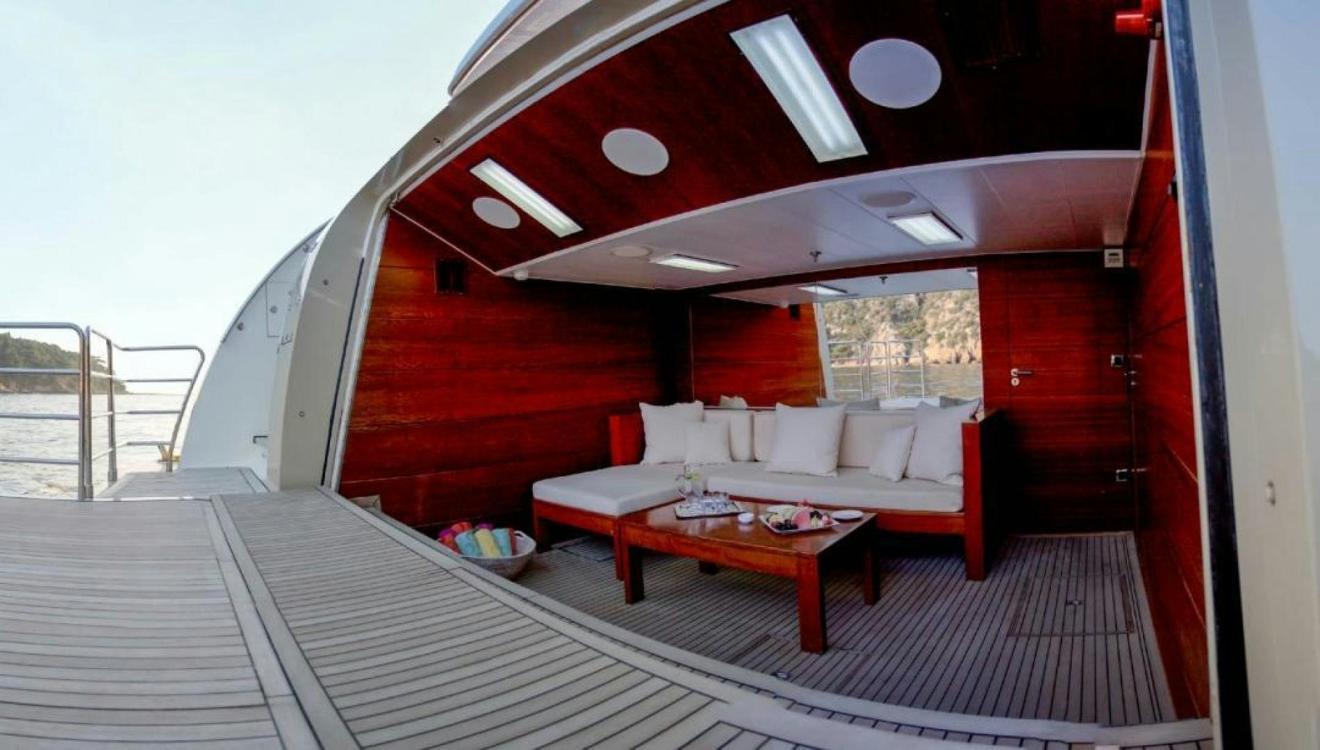 a room with a bed and a table aboard PANAKEIA Yacht for Charter