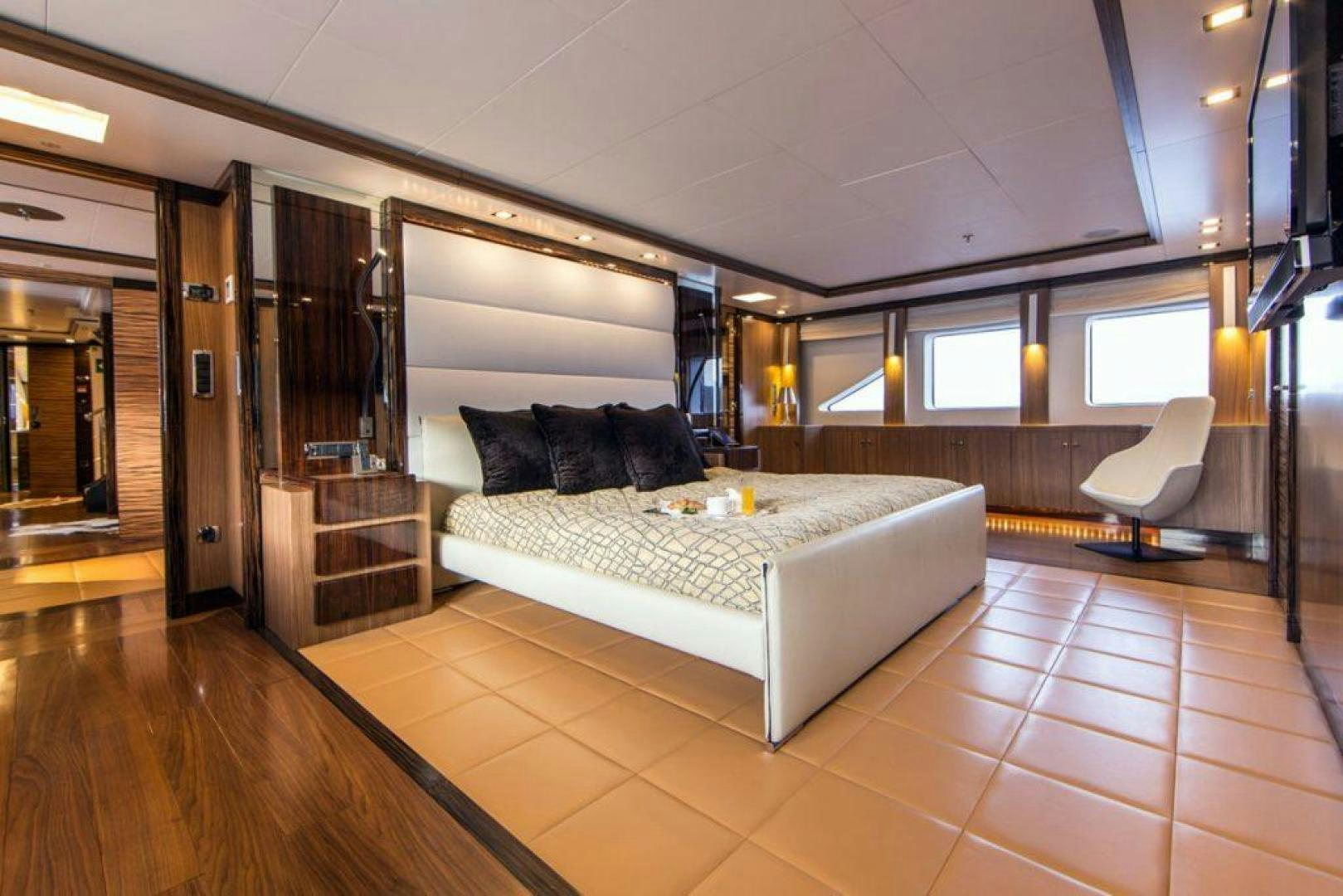 a large bedroom with a large bed aboard PANAKEIA Yacht for Charter