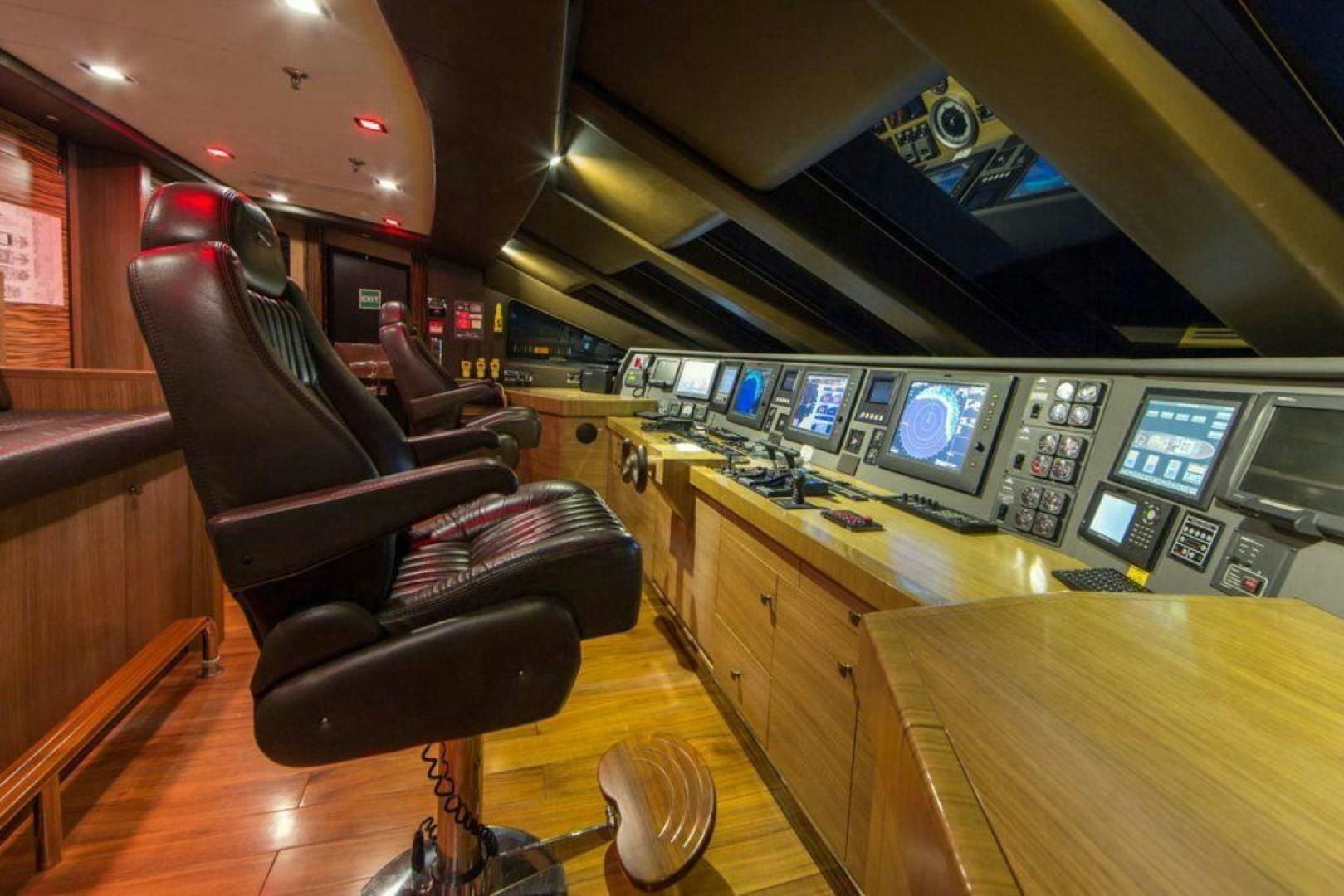 a room with a desk and chairs aboard PANAKEIA Yacht for Charter