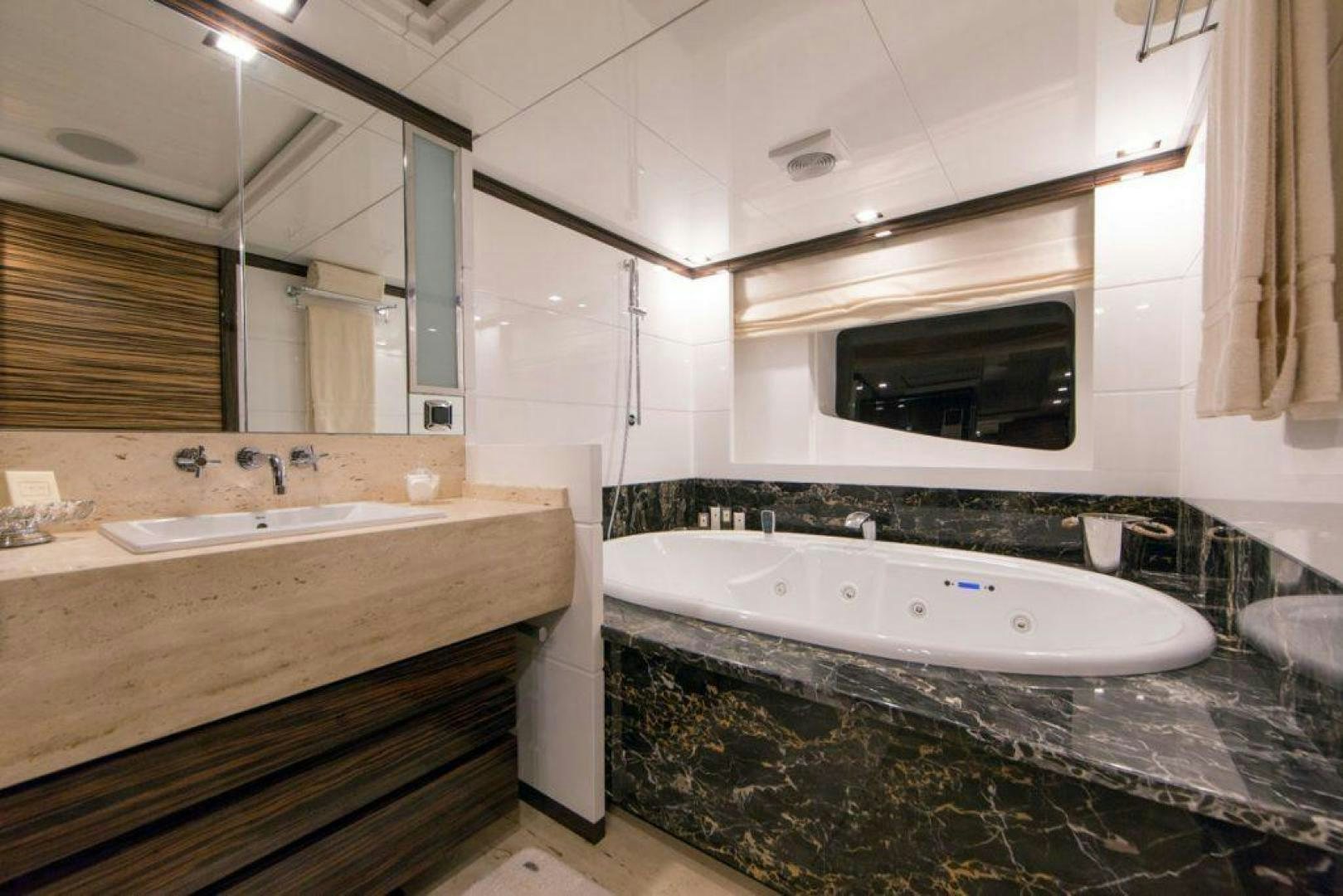 a bathroom with a large bathtub aboard PANAKEIA Yacht for Charter