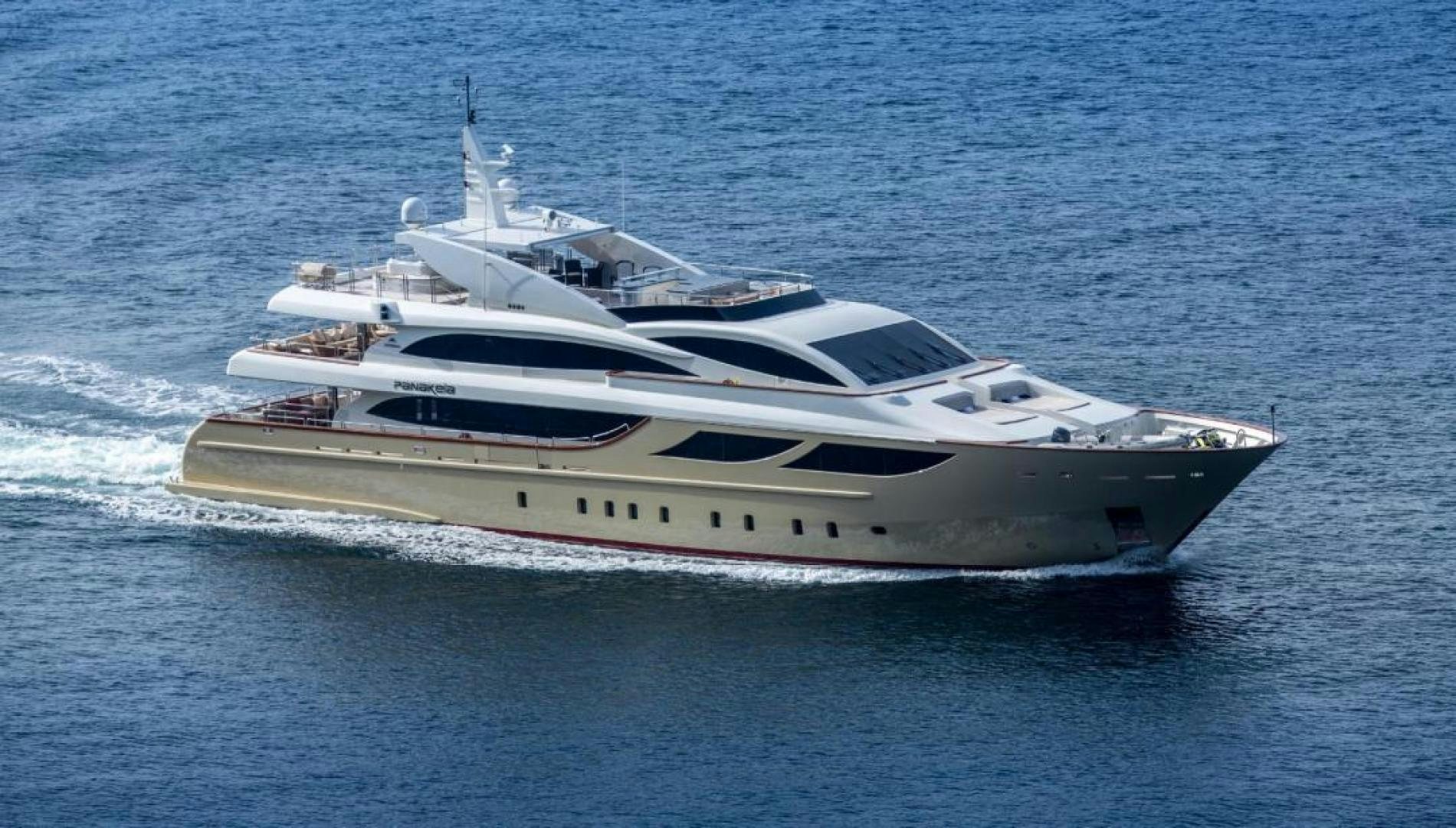 a white yacht in the ocean aboard PANAKEIA Yacht for Charter