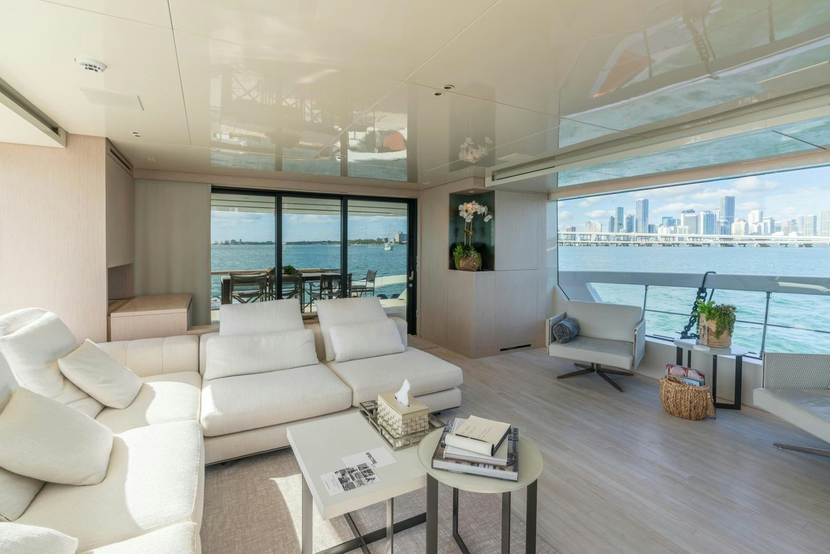 a living room with a large window aboard MAVE Yacht for Sale