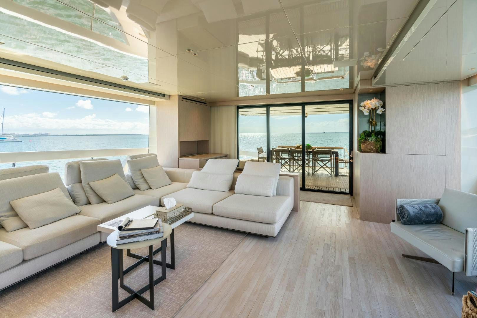 a living room with a large window aboard MAVE Yacht for Sale