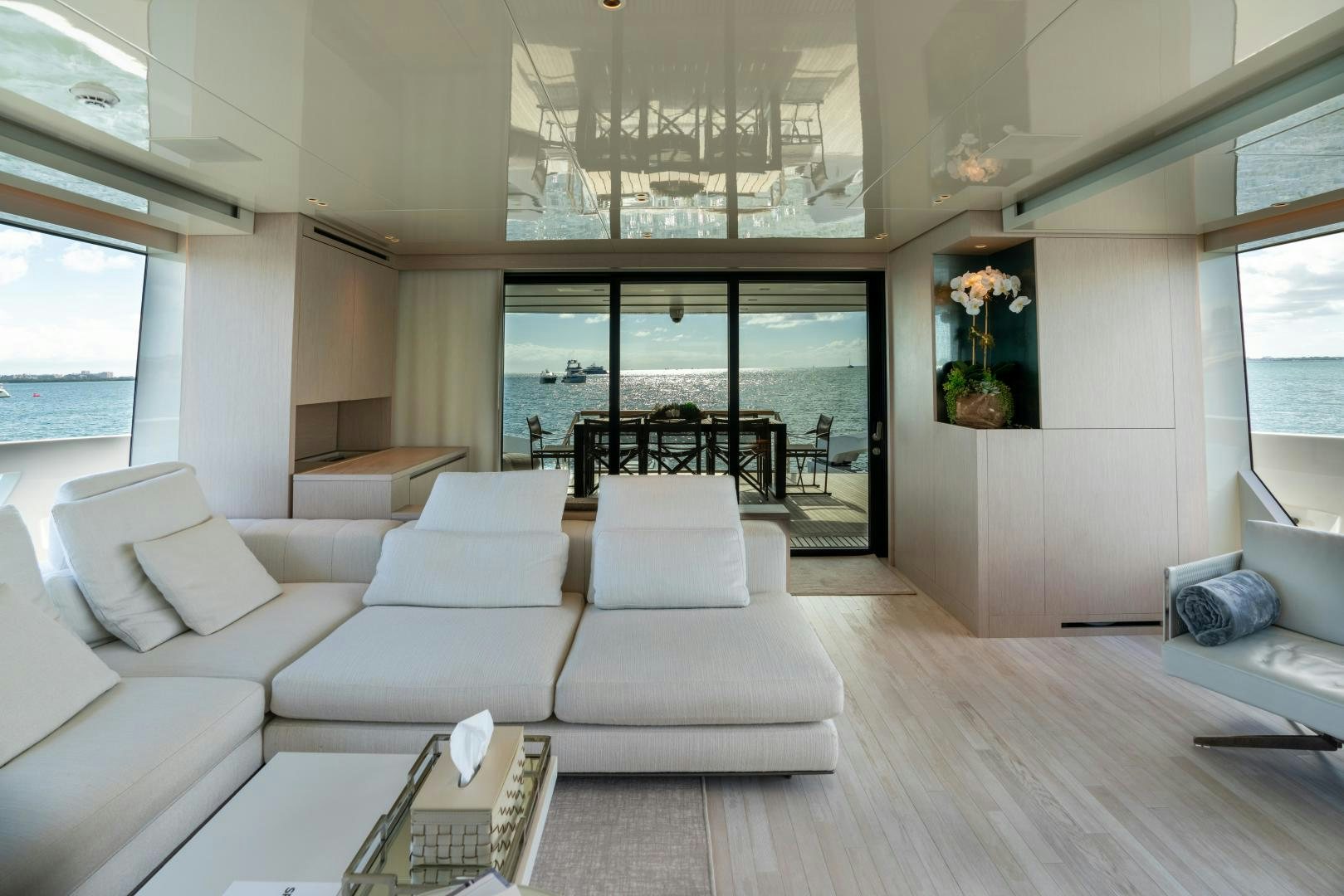 a living room with a wood floor aboard MAVE Yacht for Sale