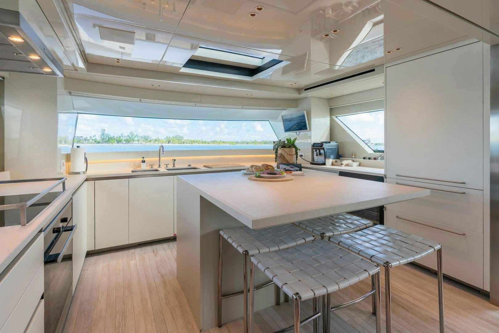 a kitchen with a table and chairs aboard MAVE Yacht for Sale