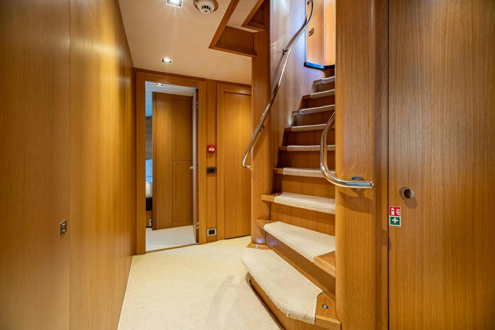 a set of stairs leading to a door aboard CORAZON Yacht for Sale