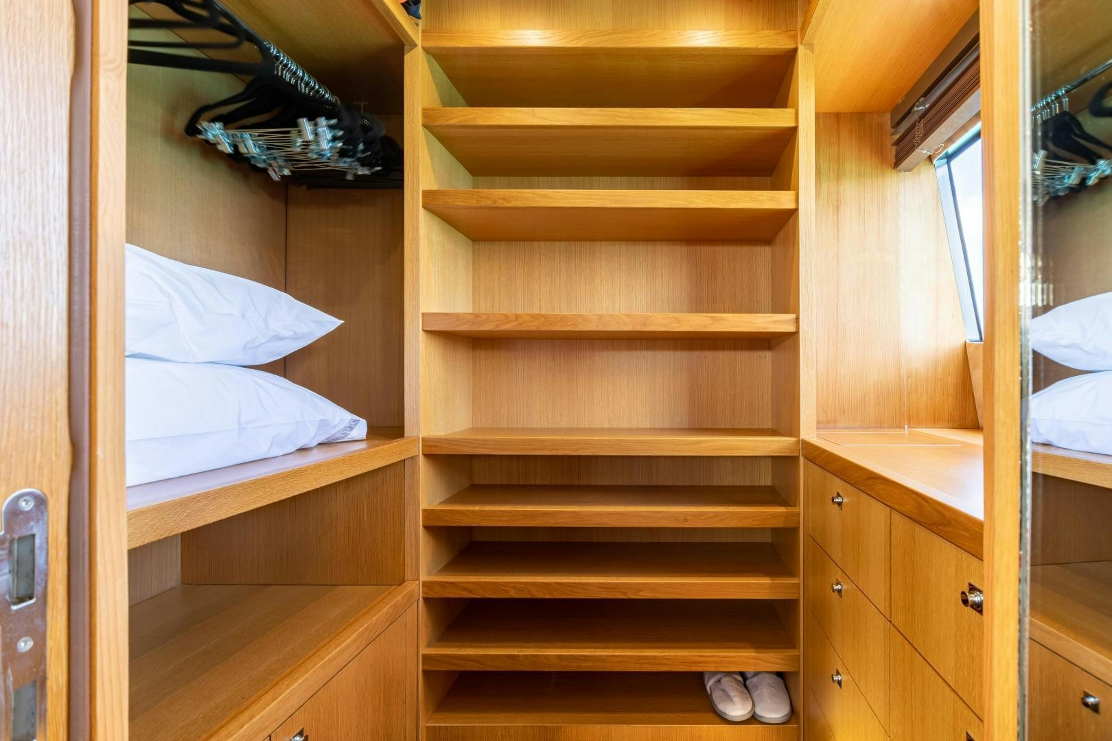 a wooden bunk bed in a room aboard CORAZON Yacht for Sale