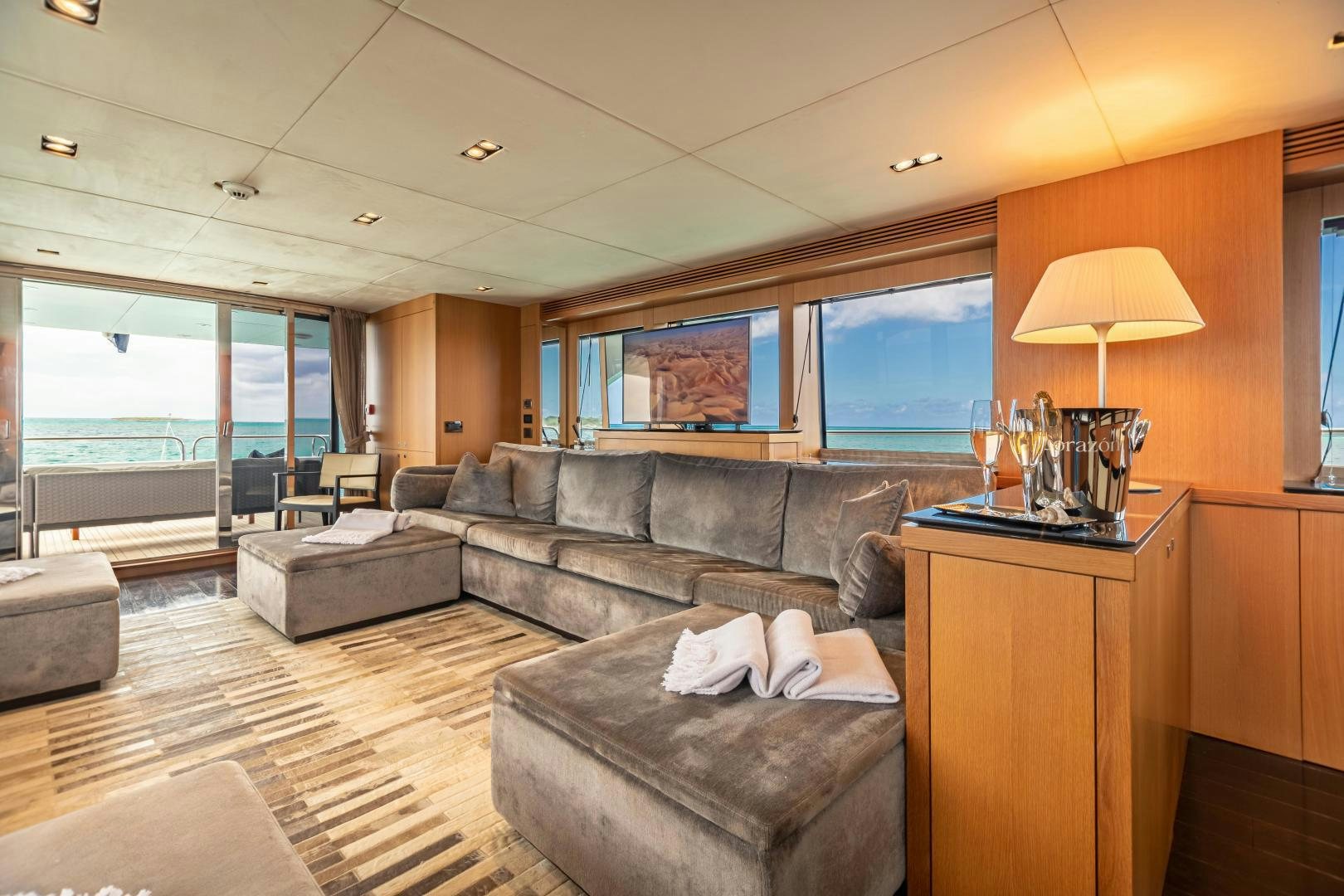 a living room with a leather couch aboard CORAZON Yacht for Sale