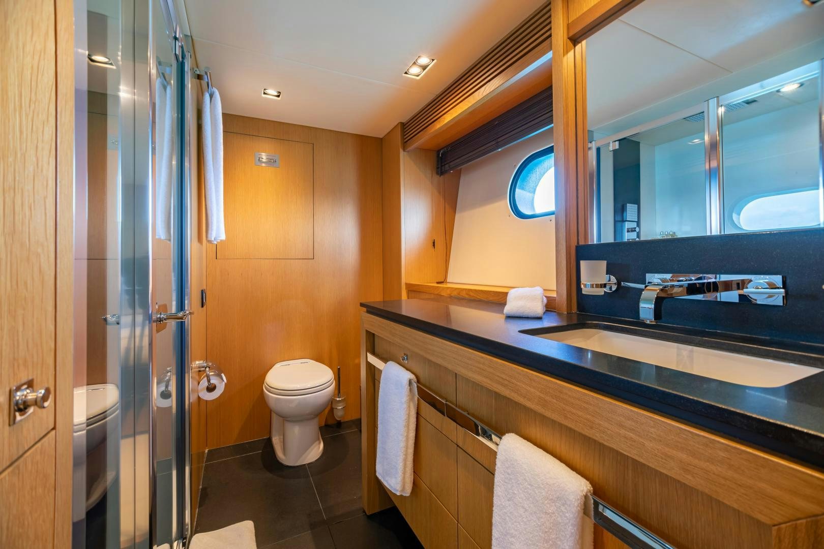 a bathroom with a sink and a toilet aboard CORAZON Yacht for Sale