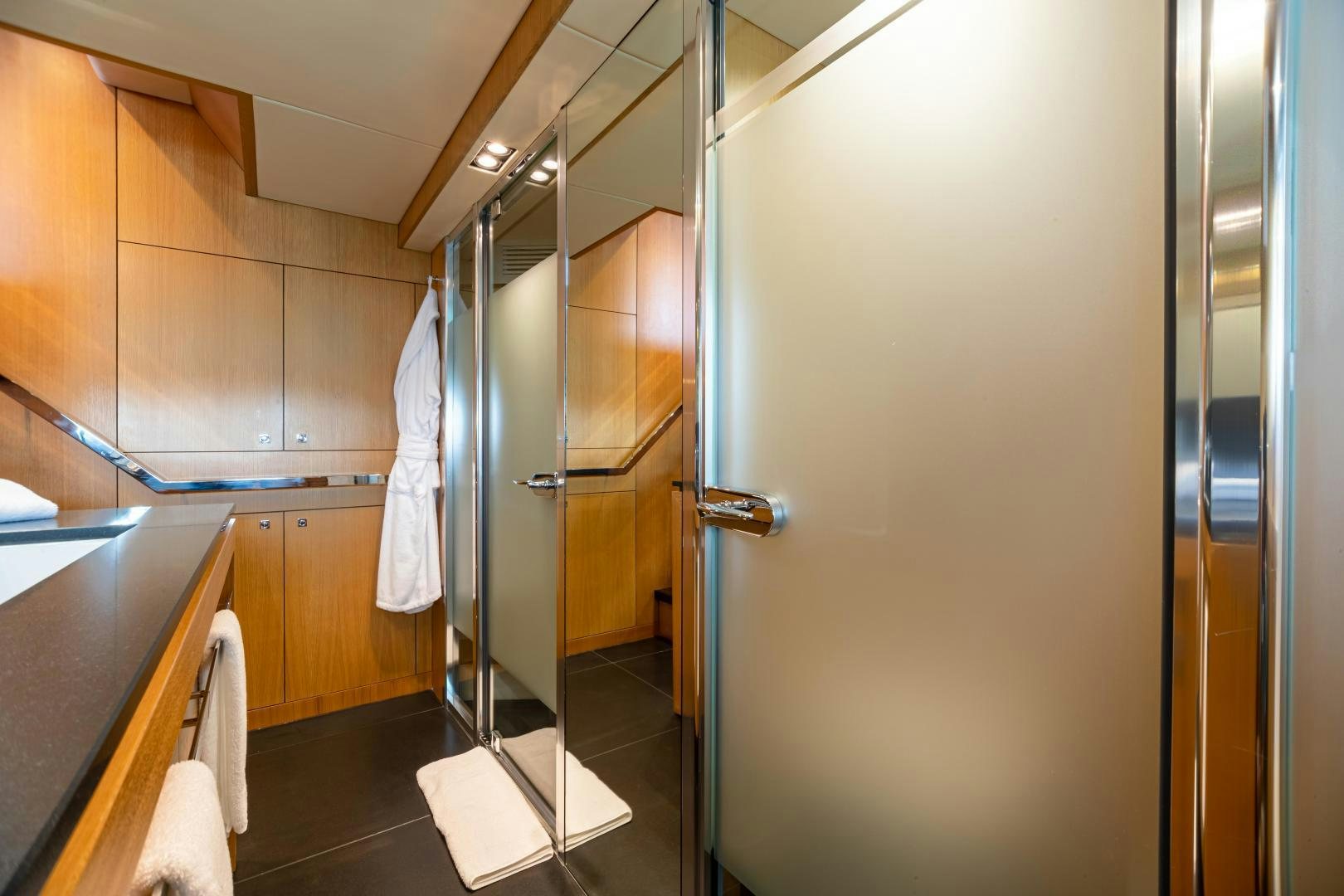 a bathroom with a standup shower aboard CORAZON Yacht for Sale
